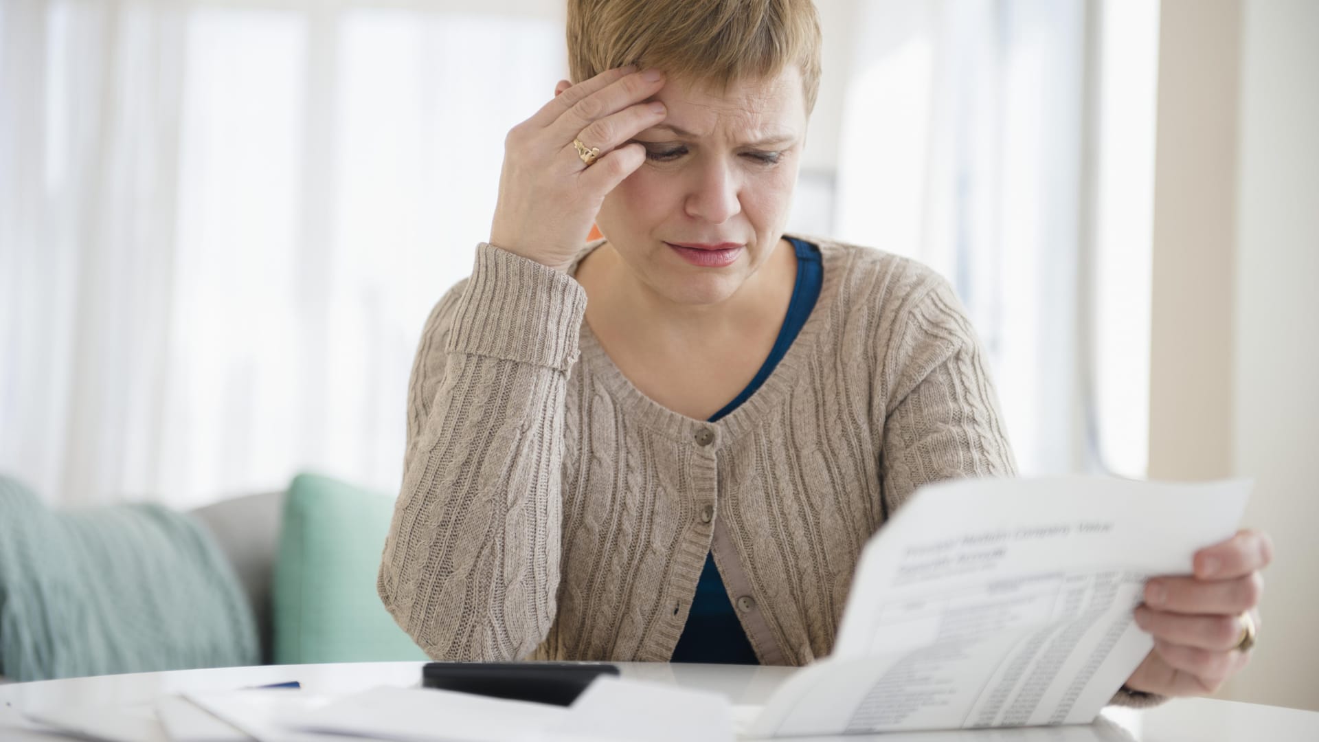 Thinking of consolidating your debt? Here are the pros and cons you need to know